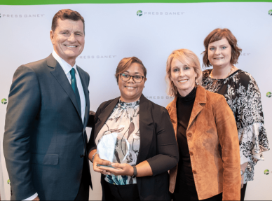From left, Press Ganey Chief Executive Officer Patrick T. Ryan presents North Oaks’ 2018 Guardian of Excellence Award® to Vice President of Clinics Kanna Page, Physician Group Regional Director Eve Allen and Practice Administrator Beth Richard.
